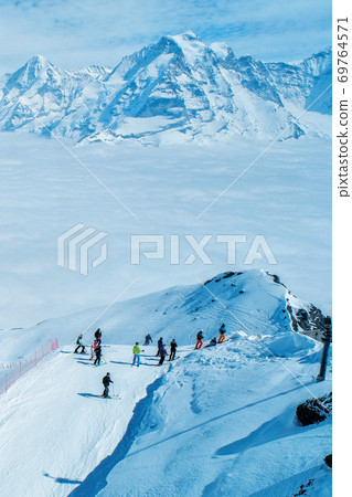 Stunning Panoramic view Snow moutain of the Swiss Skyline from Schilthorn, Switzerland Stunning Panoramic view Snow moutain of the Swiss Skyline from Schilthorn, Switzerland 69764571