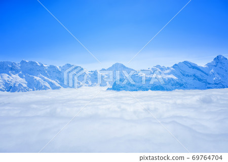 Stunning Panoramic view Snow moutain of the Swiss Skyline from Schilthorn, Switzerland Stunning Panoramic view Snow moutain of the Swiss Skyline from Schilthorn, Switzerland 69764704