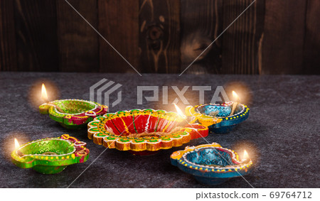 clay lit light a fire already on Diya or oil lamp clay lit light a fire already on Diya or oil lamp 69764712