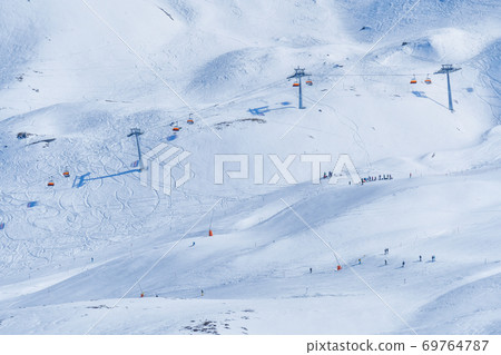 Panoramic view of ski chair lift in high mountains in Switzerland 69764787