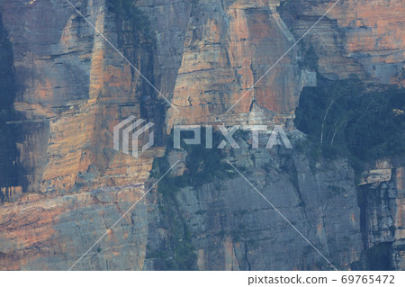 A cliff face in Jamison Valley in The Blue Mountains in New South Wales in Australia A cliff face in Jamison Valley in The Blue Mountains in New South Wales in Australia 69765472