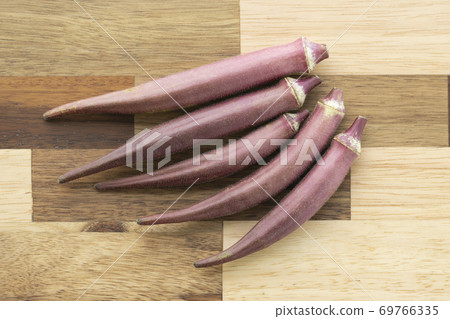 Red okra on the cutting board Red okra on the cutting board 69766335