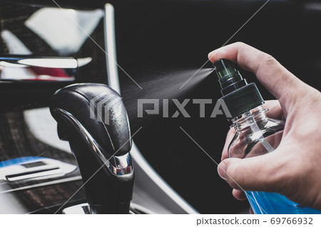 Cleaning gear lever with alcohol sanitizing spray Cleaning gear lever with alcohol sanitizing spray 69766932