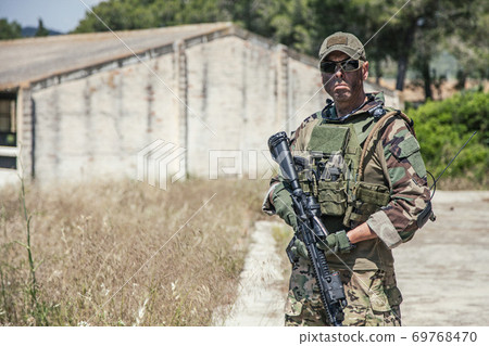Portrait of equipped, armed US Navy SEALs fighter 69768470
