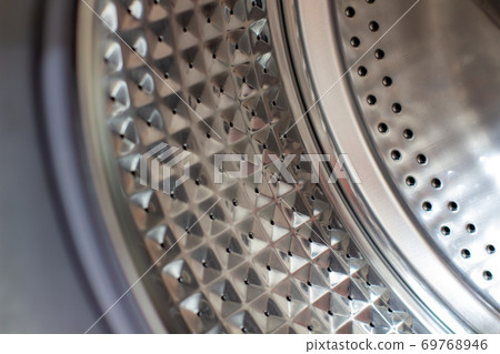 Drum of washing machine dry and clean close-up.Washing Dryer Machine inside view of a drum 69768946