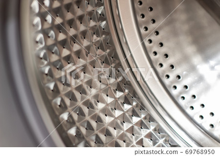 Drum of washing machine dry and clean close-up.Washing Dryer Machine inside view of a drum 69768950