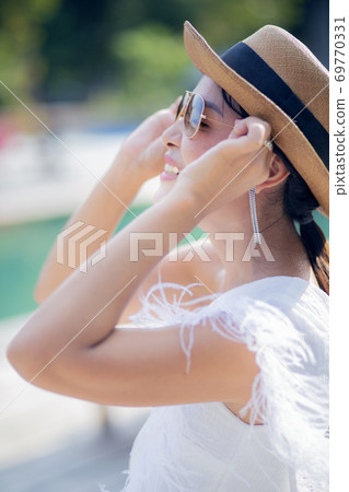 beautiful woman wearing sunglasses toothy smiling face with happiness beautiful woman wearing sunglasses toothy smiling face with happiness 69770331