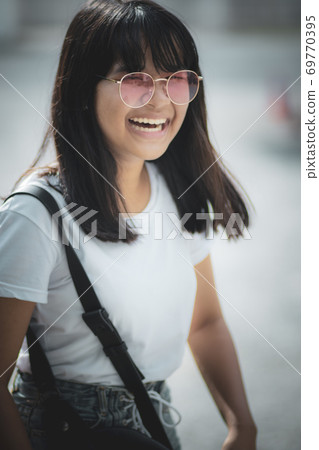 happiness face of asian teenager standing outdoor 69770395