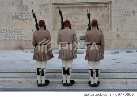 Evzones, the honorary Greek Presidentiial Guard, at the Tomb of the Unknown Soldier. Center of Athens Greece, Syntagma Square. 69770809