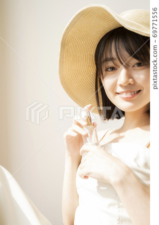 Woman with lotion Woman with lotion 69771556