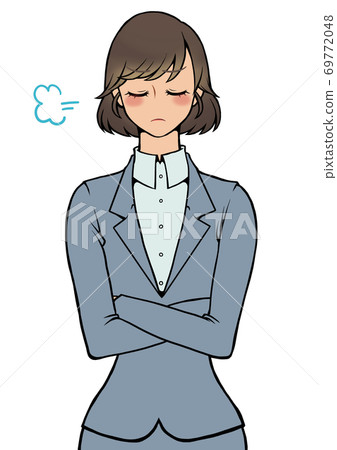 Woman in an angry suit with her arms folded Woman in an angry suit with her arms folded 69772048