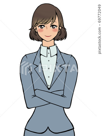 A woman in a suit with her arms folded and smiling A woman in a suit with her arms folded and smiling 69772049