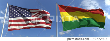 Flying flags of the United States and Bolivia on sky background, 3d rendering 69772903
