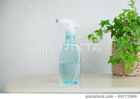 Antiseptic solution for coronavirus prevention, placed on a table 69772999