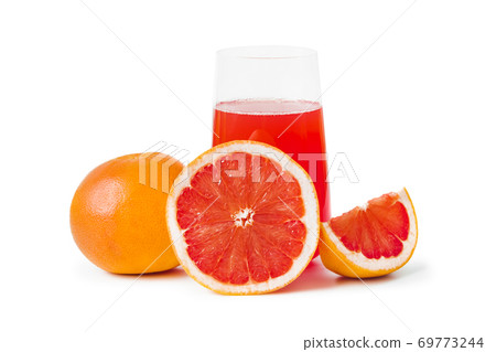 Ripe grapefruits and glass of juice Ripe grapefruits and glass of juice 69773244