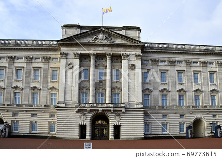 Buckingham Palace with the British Queen Flag Fluttering Buckingham Palace with the British Queen Flag Fluttering 69773615