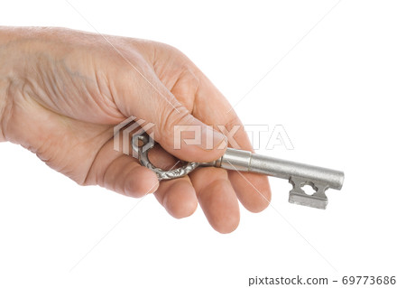 Hand with retro silver key 69773686