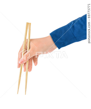 Hand with chopsticks Hand with chopsticks 69773771