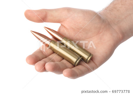 Hand with bullets 69773778