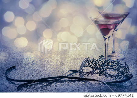 carnival mask and glasses with glittering background and copy space 69774141