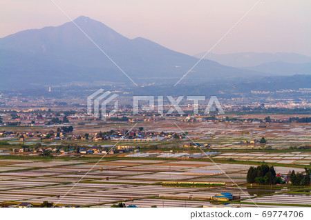 Tadami Line train running through the paddy fields at dusk, Aizumisato Town, Fukushima Prefecture 69774706