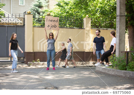 Dude with sign - woman stands protesting things that annoy him 69775060