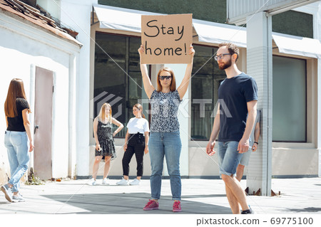 Dude with sign - woman stands protesting things that annoy him 69775100