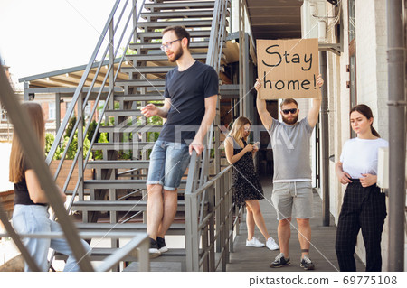 Dude with sign - man stands protesting things that annoy him 69775108