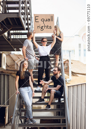 Dude with sign - woman stands protesting things that annoy him 69775110
