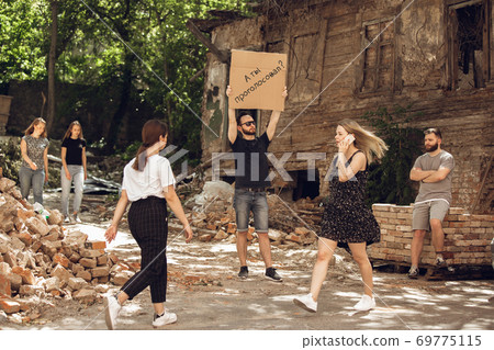 Dude with sign - man stands protesting things that annoy him 69775115