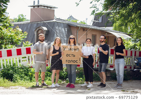 Dude with sign - woman stands protesting things that annoy him 69775129