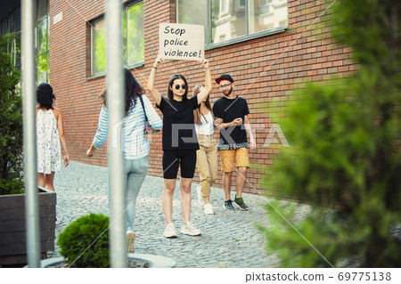 Dude with sign - woman stands protesting things that annoy him 69775138