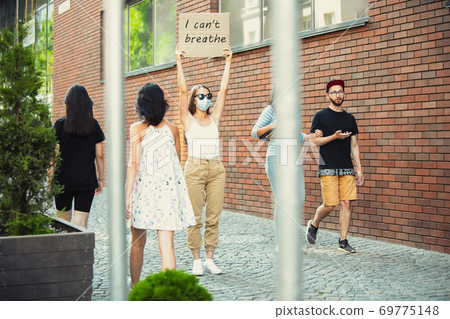 Dude with sign - woman stands protesting things that annoy him 69775148