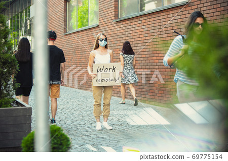 Dude with sign - woman stands protesting things that annoy him 69775154