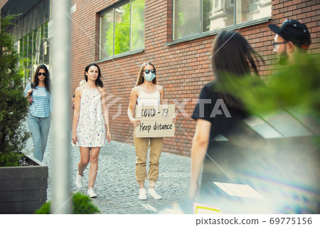 Dude with sign - woman stands protesting things that annoy him 69775156