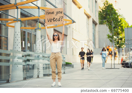 Dude with sign - woman stands protesting things that annoy him 69775400