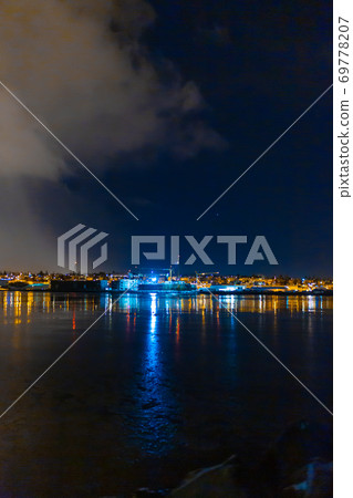 Night photo of Reykjavik city beach. Waterfront lights Night photo of Reykjavik city beach. Waterfront lights 69778207
