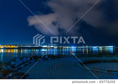 Night photo of Reykjavik city beach. Waterfront lights Night photo of Reykjavik city beach. Waterfront lights 69778208