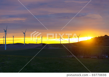 Wind Turbines in field against sunset sky, Spain Wind Turbines in field against sunset sky, Spain 69778698