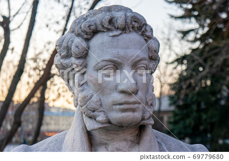 Moscow, Russia - March 24, 2020: Monument to the great Russian poet Alexander Pushkin on the background of trees Moscow, Russia - March 24, 2020: Monument to the great Russian poet Alexander Pushkin on the background of trees 69779680