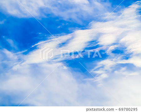 A beautiful rainbow cloud floating in the blue sky A beautiful rainbow cloud floating in the blue sky 69780295