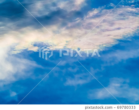 A beautiful rainbow cloud floating in the blue sky 69780333