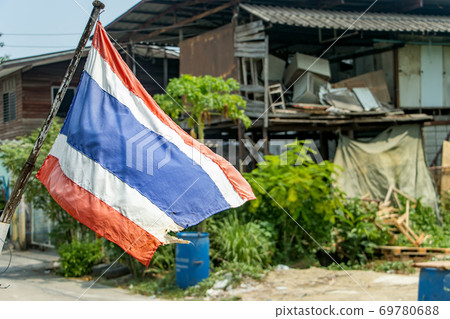 The national flag of Thailand flutters on the street on the outskirts of the city. The national flag of Thailand flutters on the street on the outskirts of the city. 69780688