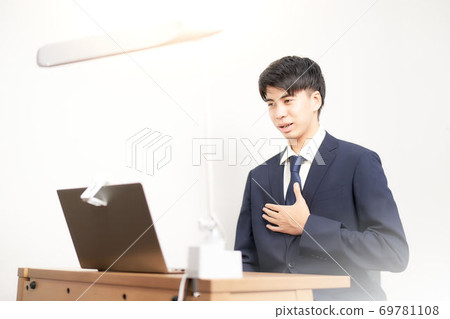 Male student undergoing a remote interview 69781108