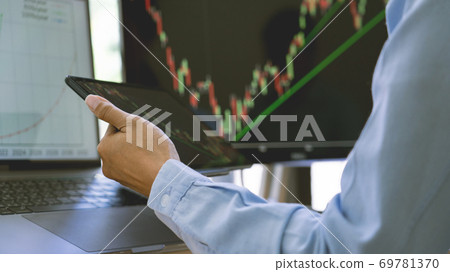 stock exchange trader working with graphs,diagrams on monitor in modern trading office stock exchange trader working with graphs,diagrams on monitor in modern trading office 69781370