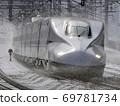 Shinkansen N700 series running in sprinkler operation 69781734