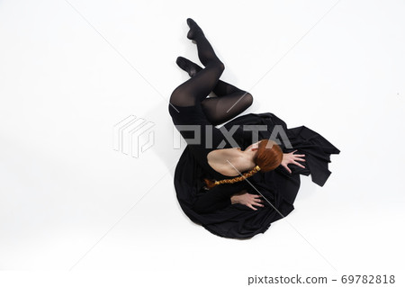 Young and graceful ballet dancer in minimal black style isolated on white studio background 69782818