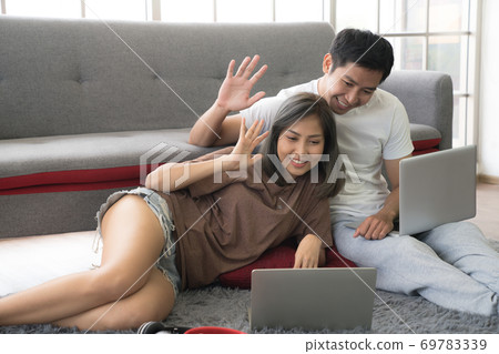 Asian couple business persons using laptop computers and working from home 69783339