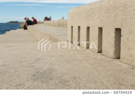 People sitting by Sea Organ People sitting by Sea Organ 69784429