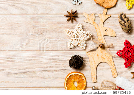 Top view of Christmas decorations and toys on wooden background. Copy space. Empty place for your design. New Year concept 69785456